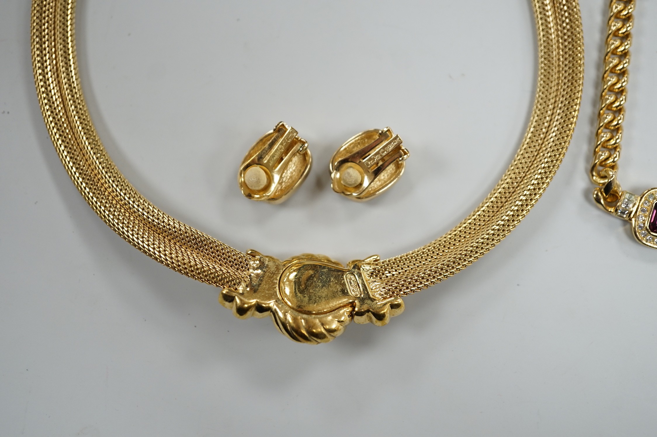 A modern Christian Dior gilt metal and two colour paste set necklace, 37cm and a pair of matching ear clips and one other Christian Dior necklace.